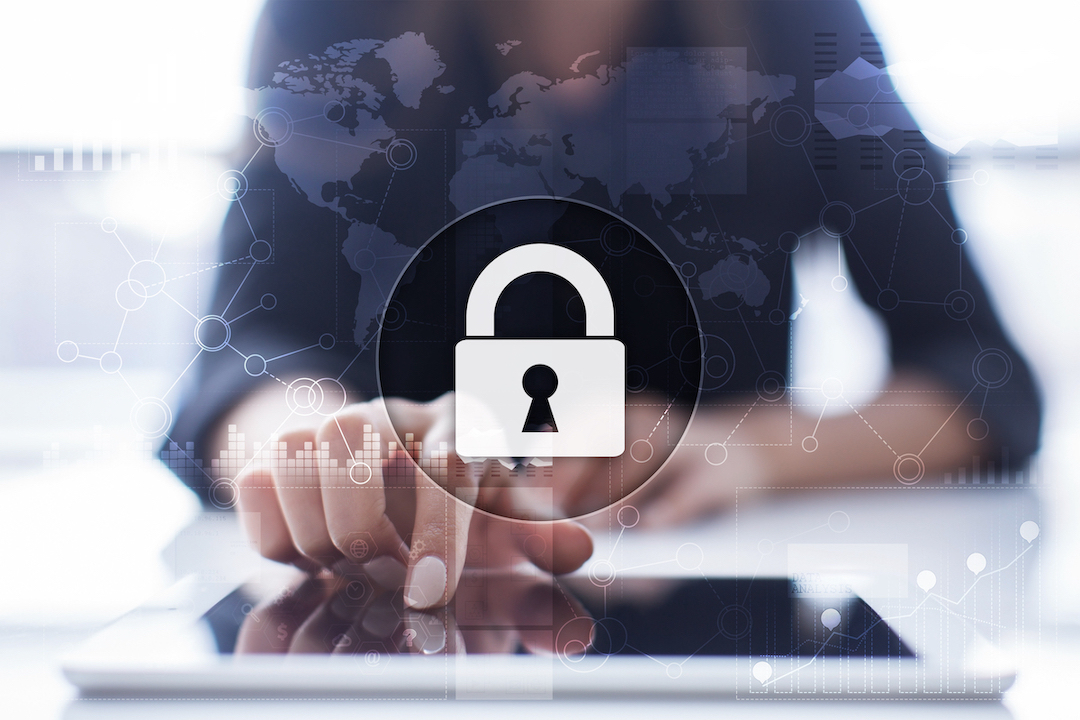 Person in front of a tablet computer covered by a security lock