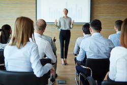 Seminar moderator in front of participants